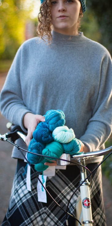 girl, bike, blue yarn