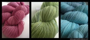 SpaceCadet Creations yarns for knitting and crochet, dyed in the colours of Camille Roskelley's quilt on a green bed