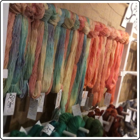 Setting up SpaceCadet yarns in the Melissa Jean Designs booth at Rhinebeck 