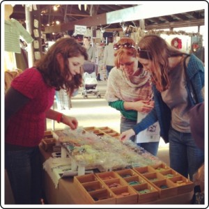 Choosing buttons at the Melissa Jean Designs booth at Rhinebeck