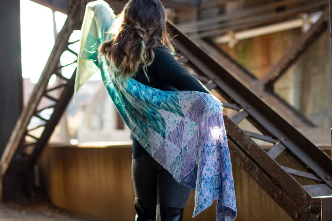 The Striad Wrap by Stephanie Alford, constructed in a series of short row triangles, knit individually in strips and joined together without any seaming up.