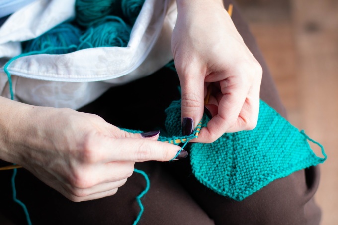 My assistant knitting the Striad Wrap 